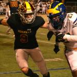 Defensive back Wyatt Neu (No. 9) applies pressure at the line of scrimmage. Photo by Kevin Hanson