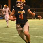 PHOTOS BY KEVIN HANSON
Quarterback Gunnar Trachte (No. 4) heads downfield after being flushed from the pocket. Photo by Kevin Hanson
