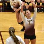 Enumclaw High setter Haley Dumontet (3) puts the ball in play as teammates Jayden Coffee (13) and Bella Firnkoess (7) head to the net. The action came during Enumclaws thrilling, five-set victory October 26 over White River. Photo by Kevin Hanson