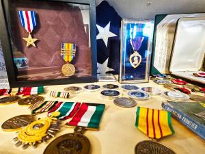 Photos by Ray Miller-Still
The Buckley Foothills Historical Museum is unveiling a new local veterans exhibit on Veterans Day weekend, Nov. 11 and 12. Some of the items featured is a WWI Purple Heart from Corporal John Abraham and the marine uniform of Buckley Senior Center Coordinator Chloe Mickelson.