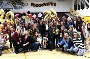 Submitted photo
Longtime Enumclaw High volleyball coach Jackie Carel (center, in white blouse and dark jacket) was honored the evening of October 31, prior to the Hornets final home match of the season. The ceremony included a presentations from the volleyball officials association, the EHS volleyball alumni group and the EHS Athletic Department.