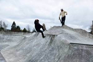 Kasey Craft, in the white, and Joseff Kushmaul, in black, were two of the first people to get rolling on Enumclaw's new skatepark. Photo by Ray Miller-Still