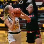Photo by Kevin Hanson
WRHS Vivian Kingston (34) prepares to put up a shot under the basket during a match against the Orting Cardinals last year; the Hornets came away with a 68-16 win.