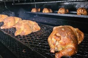 Jason Comnick, a chef graduated from Le Cordon Bleu cooking school, smokes a different meat every day for the Yella Beak's new specials. Photo by Ray Miller-Still