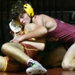 WRs Hunter Oswold (yellow headgear) gets the better of his EHS opponent during a Jan. 18, 2023 match against Enumclaw High. Photo by Kevin Hanson