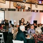 Photo by Lauren Lilly / laurenlillyphotography.com
Pictured is Rainier Foothills Wellness Foundations Executive Director Sara Stratton collecting Heads or Tails game entry cards during the live auction.