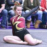 The Plateaus prep gymnastics program is a joint affair, with girls from both Enumclaw and White River high schools making up the team. The gymnasts compete as a single entity during the regular season, then represent their individual schools once postseason rolls around. The program, under the direction of coach Ben Skipworth, has just two home meets this season. The first was on Dec. 15 at Peak Gymnastics. Pictured here are three members of the squad, all performing during the floor exercise: Julia Carter sets off across the mat for her final tumbling routine; Maci Roach points her feet to the ceiling as part of her routine; and Kylee Trudgeon strikes a pose to complete her routine. Carter is an Enumclaw High senior, Roach is a White River junior and Trudgeon is a White River sophomore. Photos by Kevin Hanson