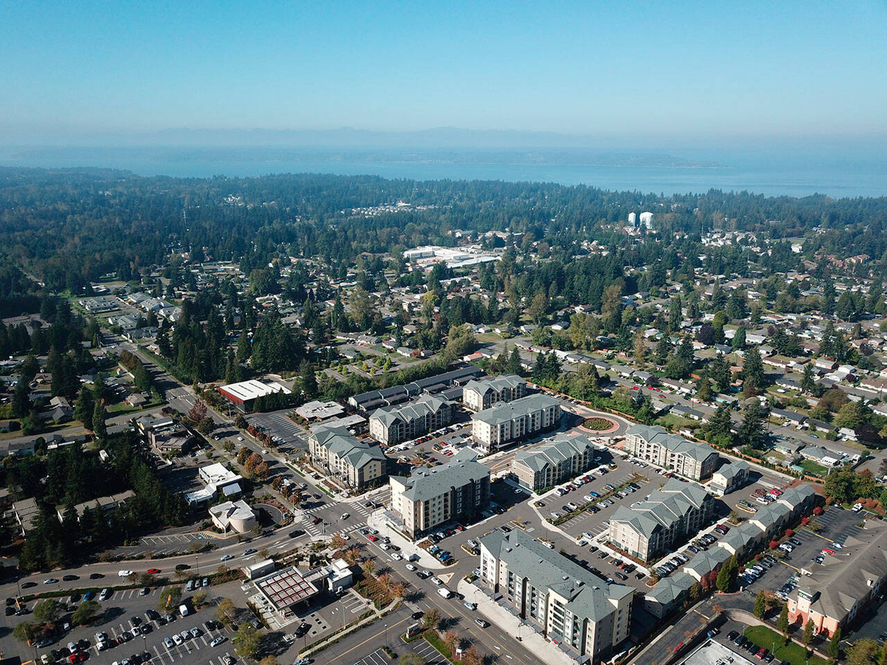 Washington faces a housing shortage, needing more than 1 million homes in the next 20 years to meet the demand, according to the Department of Commerce. Pictured: Birds eye view of apartments and single-family homes in Federal Way, Washington. (Photo courtesy of Bruce Honda)