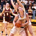 White Rivers Ava Bright slips past an Enumclaw defender on her way to the hoop during her teams January 10, home-court victory. Photo by Kevin Hanson