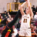 Bella Firnkoess (21) puts up a jump shot on the way to a game-high 20 points. Photo by Kevin Hanson