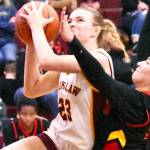 The Enumclaw High girls raced to a 20-point victory Friday night over the visiting Steilacoom Sentinels.  Pictured here is Ava Smith (23), fighting through defensive pressure on a drive to the hoop. With the 61-41 win, Enumclaw improved to 7-1 in South Puget Sound League 2A play, keeping a hold on second place. Photo by Kevin Hanson