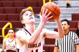 The Enumclaw High boys' basketball team advanced to the state Sweet 16 thanks to three victories in the District 2/3 tournament. Here, Landon Brauer finishes a breakaway layin during the Hornets' February 13, home court victory over North Mason. Photo by Kevin Hanson