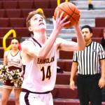 The Enumclaw High boys basketball team advanced to the state Sweet 16 thanks to three victories in the District 2/3 tournament. Here, Landon Brauer finishes a breakaway layin during the Hornets February 13, home court victory over North Mason. Photo by Kevin Hanson