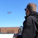 Enumclaw Police Deparments Commander Mike Graddon flying Thunderbird, his bright orange drone. Photo by Ray Miller-Still