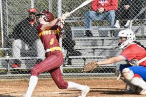 Photo by Kevin Hanson
The White River High girls had little trouble defeating the visiting Washington Patriots the afternoon of April 3. Playing on their home diamond, the Hornets scored early and often and eventually rolled to a 19-4 victory over their South Puget Sound League 2A foes. Pictured is Kennedy Selander (#3) takes a mighty cut and sends a hit into the outfield.