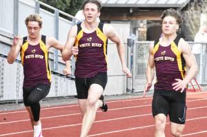 Photo by Kevin Hanson
White Rivers track and field athletes raced to easy team victories the afternoon of April 10, swamping the visitors from Foss High. In these photos, a boys race featured (from left) Hunter Maris, Tyce Donovan and Tate Bowen.