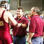 Lee Reichert coaching junior Brad McCutchen with assistant coach Guy Hanson during the 2009 state championships; McCutchen got second place that year, but the Hornets won the state championship. Courtesy photo