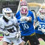 Enumclaw Highs lacrosse team improved to 11-3 overall with a Thursday night victory over the visiting Sumner Spartans. The nonleague contest saw the Hornets jump on top early and coast to a 17-10 win. Success is nothing new to the the Enumclaw crew that captured a Class 2A/1A state title a season ago. Pictured here is defenseman Anthony Mills (10) keeping a Spartan off the attack. For game information about lacrosse (and other spring sports) see the Sports Roundup. Photos by Kevin Hanson