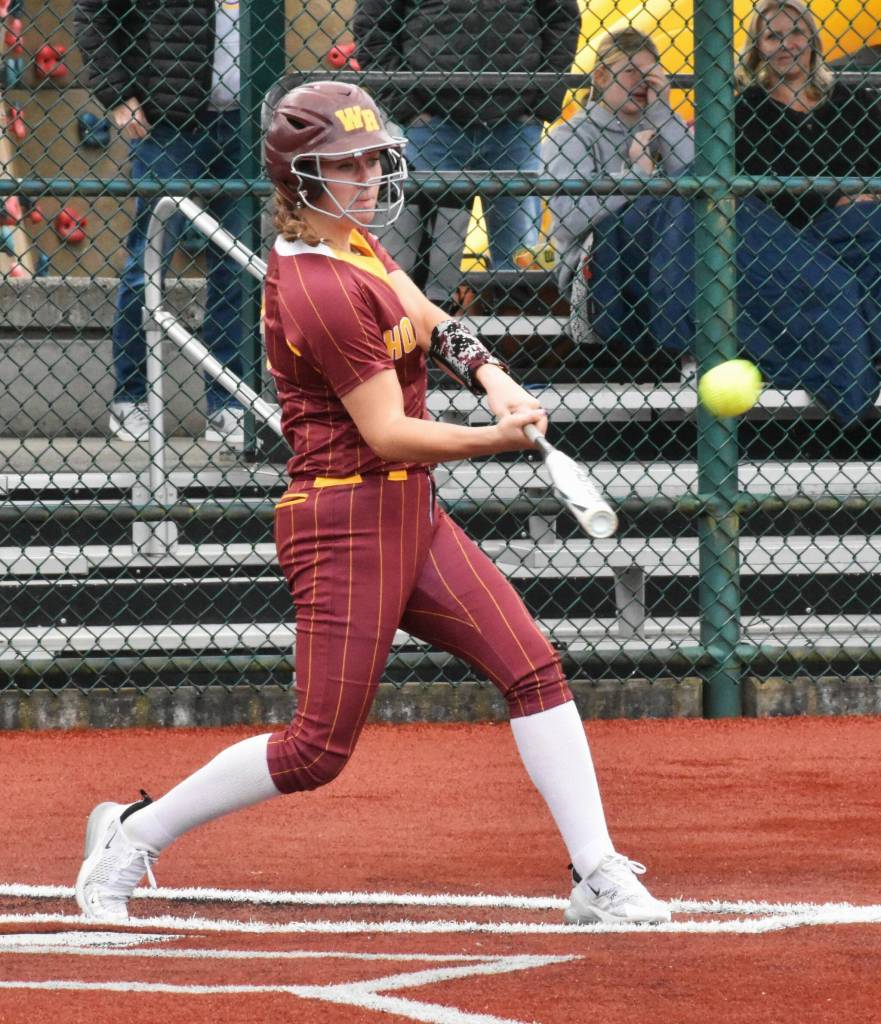 Photo by Kevin Hanson
White Rivers Ally Green crushes a pitch in the early stages of her teams 32-10 victory during the district fastpitch tournament. The ball was deposited over the outfield fence, one the of many Hornet highlights.