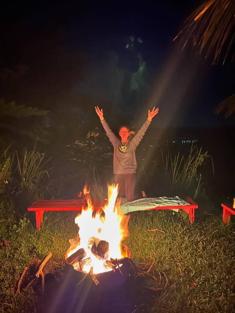 Krystal Kelley and her team recently visited Puerto Rico; here is Kelley at Utuado, where she said her team encountered a "being" (shown above her, in green). Photo courtesy Krystal Kelley