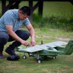 Photo courtesy Damian Floth
John Riley tinkering with his OV-10 RC plane.