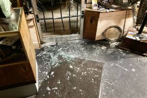 Tuttles Gun Stores front door shortly after the break-in; you can see one of the metal bars bent at the bottom. Photo courtesy Ralph Tuttle