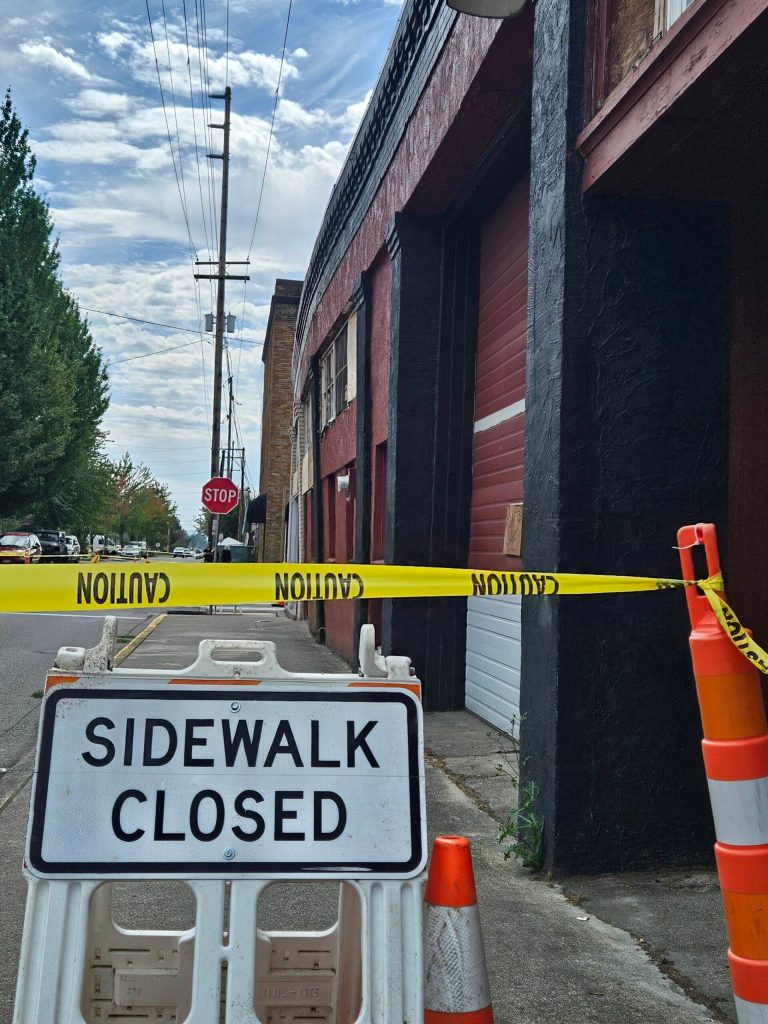 The roof of the red building is bowing out, creating concerns over its structural integrity. Photo by Ray Miller-Still