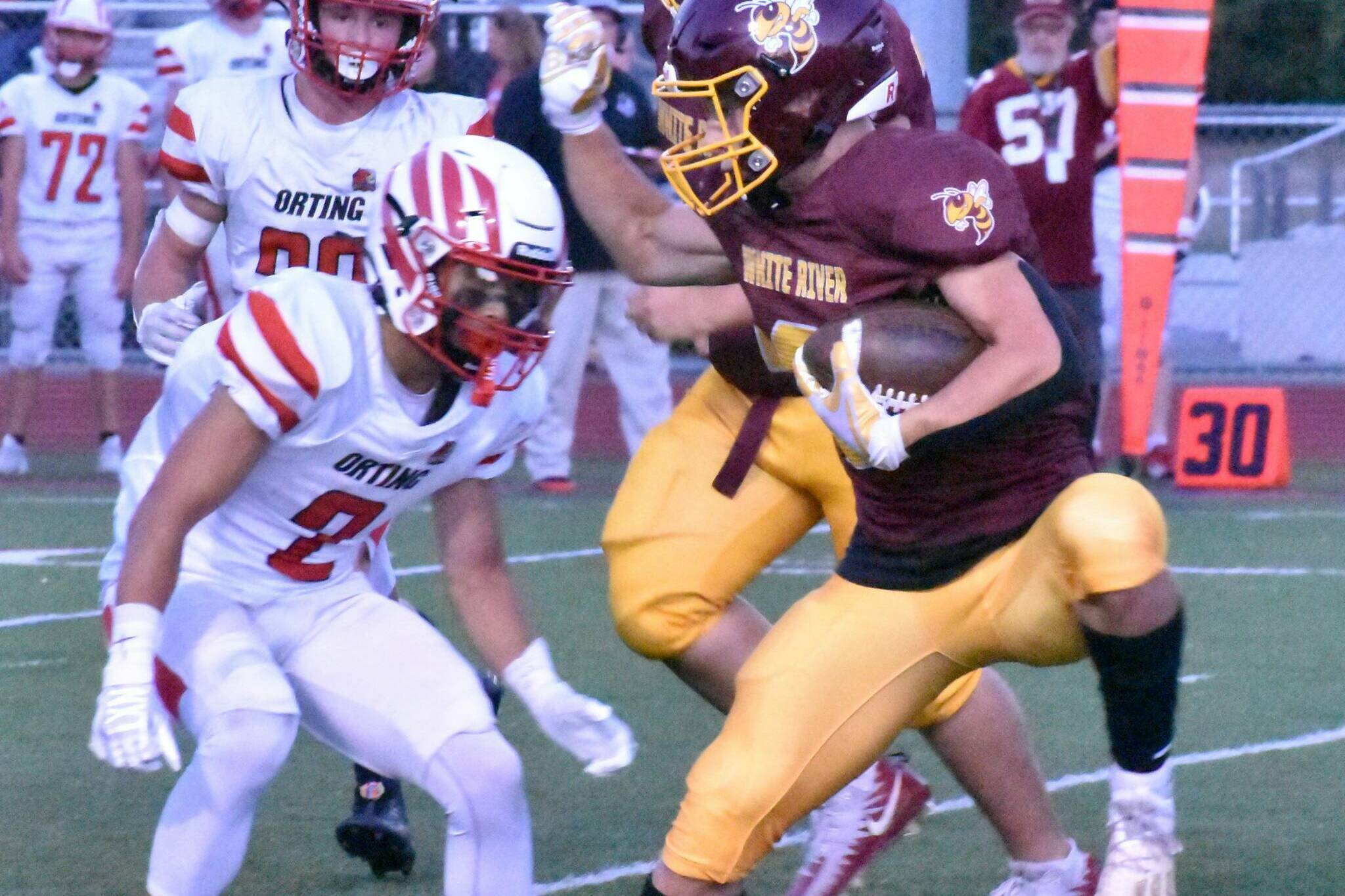 During White Rivers Sept. 14, 2023 home game against Orting, Hornet running back Tate Bowen attempts to elude a Cardinal defender.
