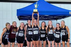 The Enumclaw High girls’ cross country team captured top honors during last year's league meet before heading to districts. Returning this year is Lily Haas (second to last on the right) and Brynne Stafford (last on the right). Contributed photo
