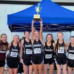 The Enumclaw High girls cross country team captured top honors during last years league meet before heading to districts. Returning this year is Lily Haas (second to last on the right) and Brynne Stafford (last on the right). Contributed photo
