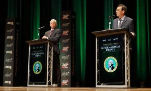 Former Congressman Dave Reichert, a Republican, left, and Washington state Attorney General Bob Ferguson, a Democrat, right, are seen on stage during the second debate of the 2024 Washington state governors race, Sept. 18, 2024, in Spokane, Wash. (Bill Lucia/Washington State Standard)