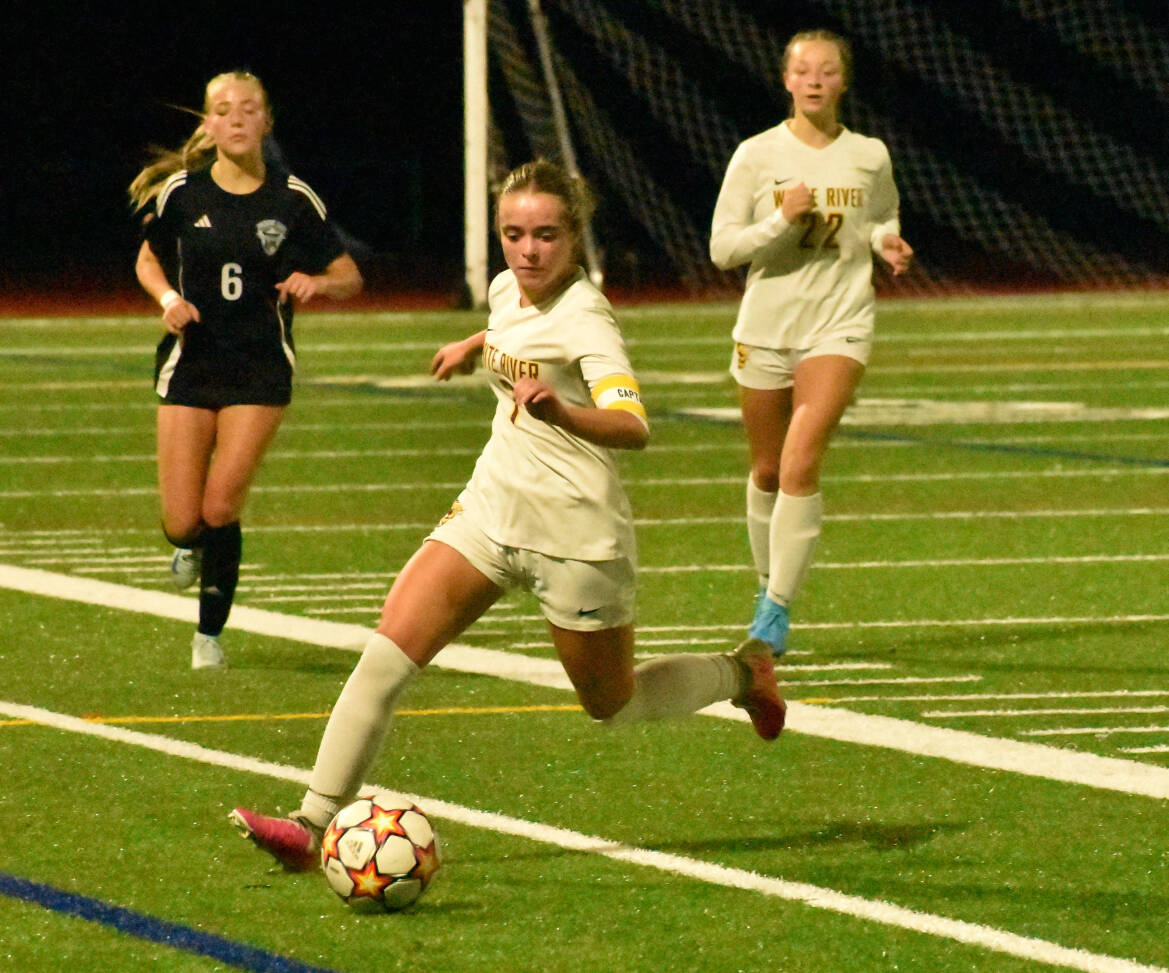 The White River High girls made the short trip to Bonney Lake High School last Thursday night for a nonleague game against the Class 4A Panthers. The teams walked off the field after battling to a scoreless tie. Pictured here are the Hornets Adalyn Sykes, chasing down a loose ball with teammate Jordyn Daigle in the background. PHOTO BY KEVIN HANSON