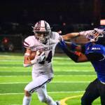 Ben Ray / The Reporter
Enumclaw senior RB Louis Chevalier stiff arms an Eagle defender.