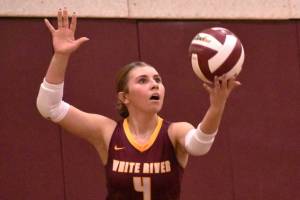 Hornets from both sides of the county line gathered the evening of September 24 to stage the volleyball version of the Battle of the Bridge. The teams from Enumclaw and White River squared off in EHS's Chuck Smith Gym, both sporting undefeated records. It was the Buckley swarm of Hornets who secured bragging rights with a three-set victory (see Sports Roundup for details). In this photo, White River's Taylor Arnold prepares to launch a second-set serve. Photo Kevin Hanson