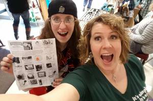 Alisa Garate (right) with a shopper showing off the Hungry Housewives vendor brochure during the 2016 event. This years craft show features more than 100 vendors. Photo courtesy Alisa Garate