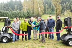Numerous representatives of various municipal and county governments, plus officials of various county and state departments, gathered on the Enumclaw Golf Course on Oct. 8 to officially cut the ribbon on a Boise Creek re-route project. Included is Enumclaw Councilmember Tom Sauvageau (second from the left) and Enumclaw Mayor Jan Molinaro (fourth from the left).