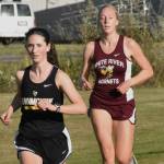 PHOTO BY KEVIN HANSON
Enumclaw and White River squared off in cross country action last week, running the 5K course in Enumclaw. Pictured here are Enumclaw's Lillian Haas and White River's Vivian Kingston who placed second and third, respectively, in the girls race. Full details from the 3A NPSL meet can be found in Sports Roundup.