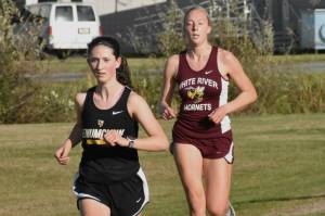 PHOTO BY KEVIN HANSON
Enumclaw and White River squared off in cross country action last week, running the 5K course in Enumclaw. Pictured here are Enumclaw's Lillian Haas and White River's Vivian Kingston who placed second and third, respectively, in the girls race. Full details from the 3A NPSL meet can be found in Sports Roundup.