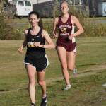 PHOTO BY KEVIN HANSON Enumclaw and White River squared off in cross country action last week, running the 5K course in Enumclaw. Pictured here are Enumclaws Lillian Haas and White Rivers Vivian Kingston who placed second and third, respectively, in the girls race. Full details from the 3A NPSL meet can be found in Sports Roundup.
