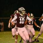 PHOTO BY KEVIN HANSON 
In their game against the Suns, EHS quarterback Gavin Trachte rolls to his right before tossing a short pass that turned into a touchdown reception by Rodarte in the first quarter.