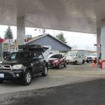 A whole line of cars waiting for gas at the Cenex station in Black Diamond. Photo by Ray Miller-Still