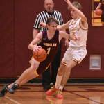 White Rivers Greg Schmitz attempting to block EHS Wyatt Neu during the 2024 Battle of the Bridge game. Photo by Kevin Hanson