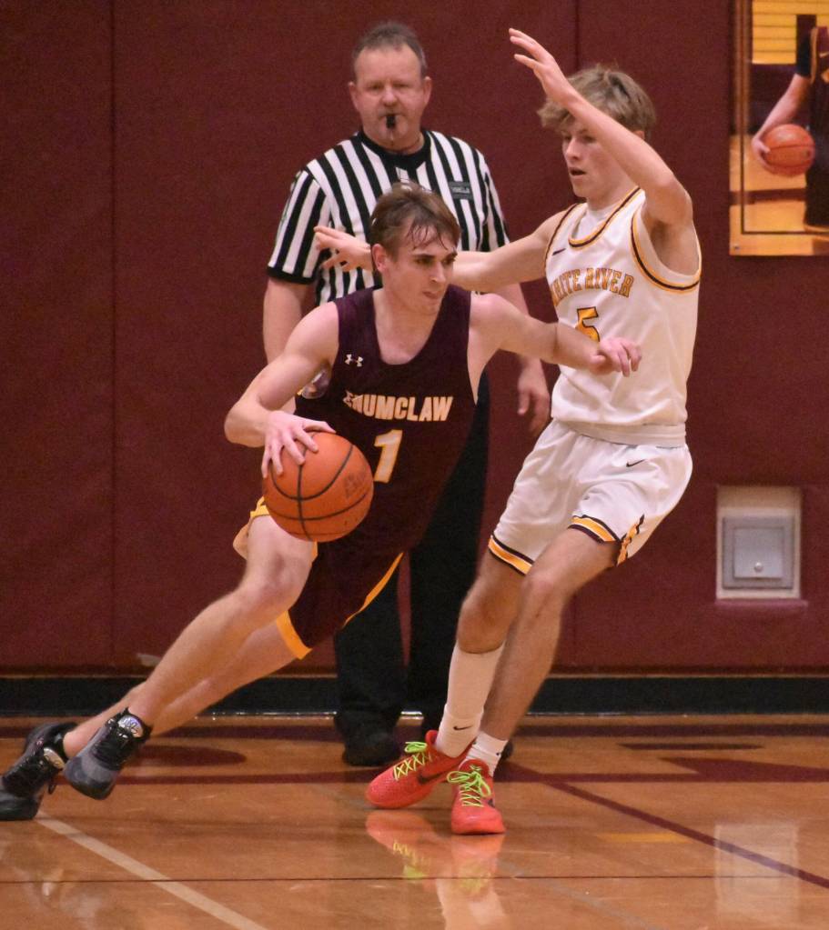 White Rivers Greg Schmitz attempting to block EHS Wyatt Neu during the 2024 Battle of the Bridge game. Photo by Kevin Hanson