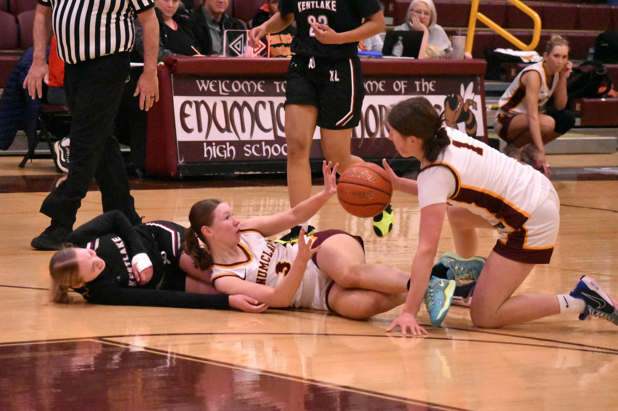 PHOTOS BY KEVIN HANSON The Enumclaw High girls had little trouble defeating the visiting Kentlake Falcons the evening of Dec.12, leading from the opening seconds and eventually posting a 65-28 victory. In this photo, Hornets Kalee Swanson (3) and Kaidyn Johnson (1) scramble for a loose ball.