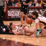 PHOTOS BY KEVIN HANSON The Enumclaw High girls had little trouble defeating the visiting Kentlake Falcons the evening of Dec.12, leading from the opening seconds and eventually posting a 65-28 victory. In this photo, Hornets Kalee Swanson (3) and Kaidyn Johnson (1) scramble for a loose ball.