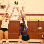 Pictured here is Rohner (12) going high for an attempted block during a district match. Photo by Kevin Hanson