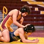 PHOTOs BY KEVIN HANSON 
The Enumclaw High boys wrestling team managed to fit a couple of tournaments into its schedule during the holidays and will return to action Jan. 8 with a dual meet at Kent-Meridian High School. The White River boys had one tourney during winter break and also will return to the mat Jan. 8 when they travel to Federal Way High to challenge the Eagles. In this photo from Enumclaws Dec. 18 victory over visiting Decatur High, Romeo Gwerder (black headgear) dominates their Gator opponents. He registered a 19-2 technical fall.