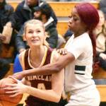 PHOTO BY KEVIN HANSON
Making her way to the basket, despite a serious foul by a Todd Beamer player, is Enumclaw Highs Isabella Pohlman.