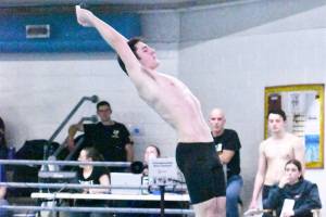 The swim and dive teams from Enumclaw High and White River took on the Federal Way Eagles on Jan. 16. Among those competing at the Enumclaw Aquatic Center was EHS diver Riley Jensen. Photo by Kevin Hanson