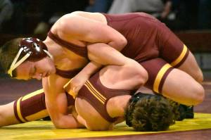PHOTOS BY KEVIN HANSON 
Wrestlers from White River made the short trip to Enumclaw Highs Chuck Smith Gymnasium the evening of January 29 for the grappling version of the Battle of the Bridge. It was the Buckley-based Hornets who emerged victorious; see Sports Roundup for full match details. In these photos, White Rivers Morgan Presly (maroon headgear) is on his way to a victory at 126 pounds and Enumclaws Caleb Grantham (yellow headgear) has the advantage at 144 pounds.